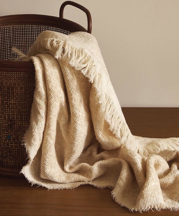 Soft cushions and blankets styled in a modern home